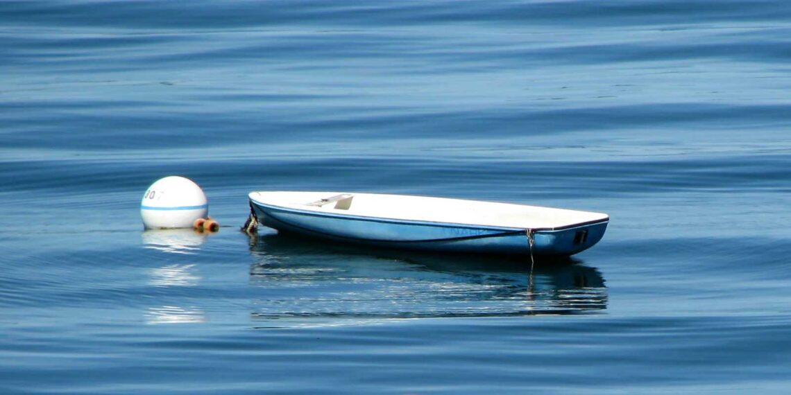 photo of rowboat tied to a buoy in Casco Bay, Maine