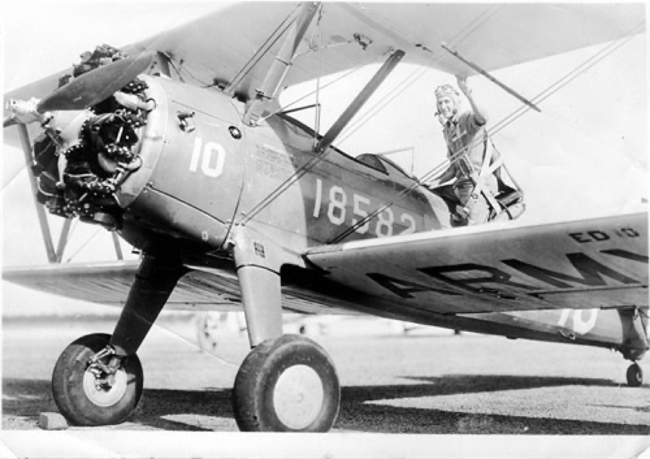 black and white photo of a Stearman biplane
