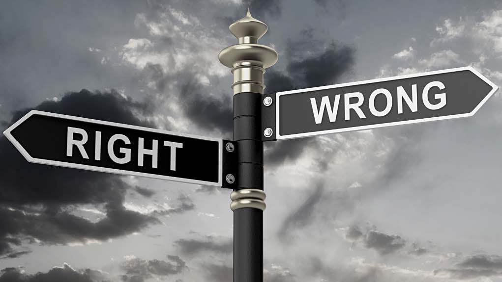 Photo of street signs that say right and wrong