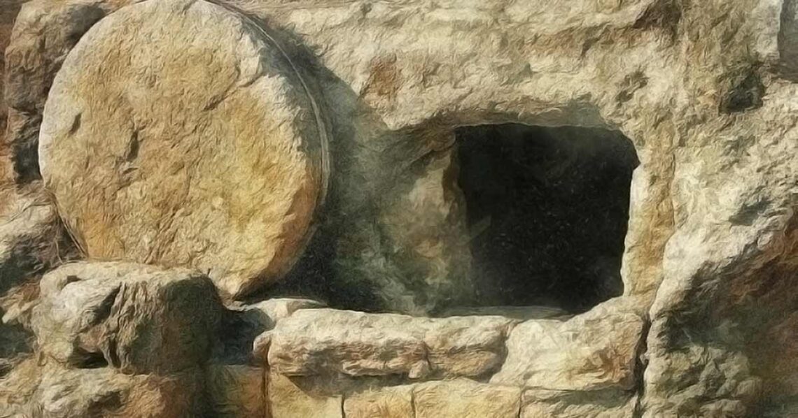photo of a circular stone outside an open tomb