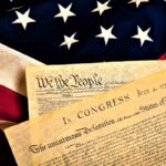 image of the American flag overlaid with images of the Declaration of Independence
