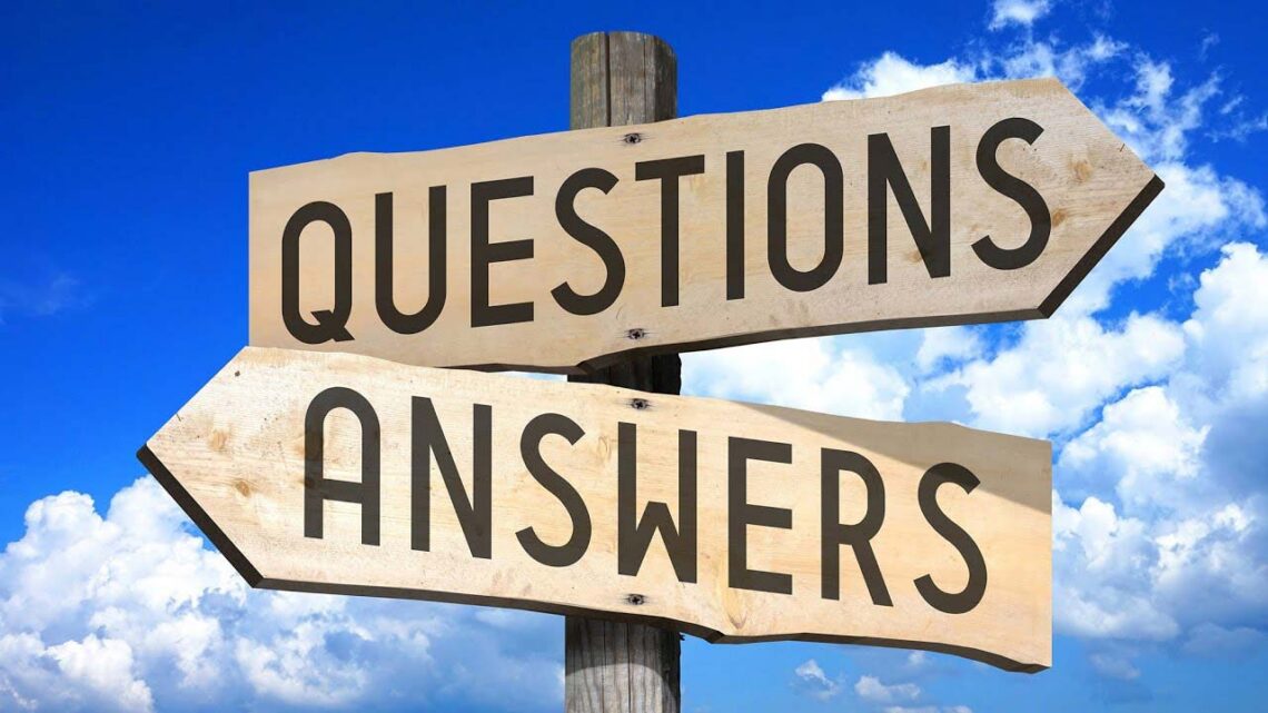 image of 2 signposts seemingly carved in wood saying Questions and Answer against a blue sky with a couple clouds